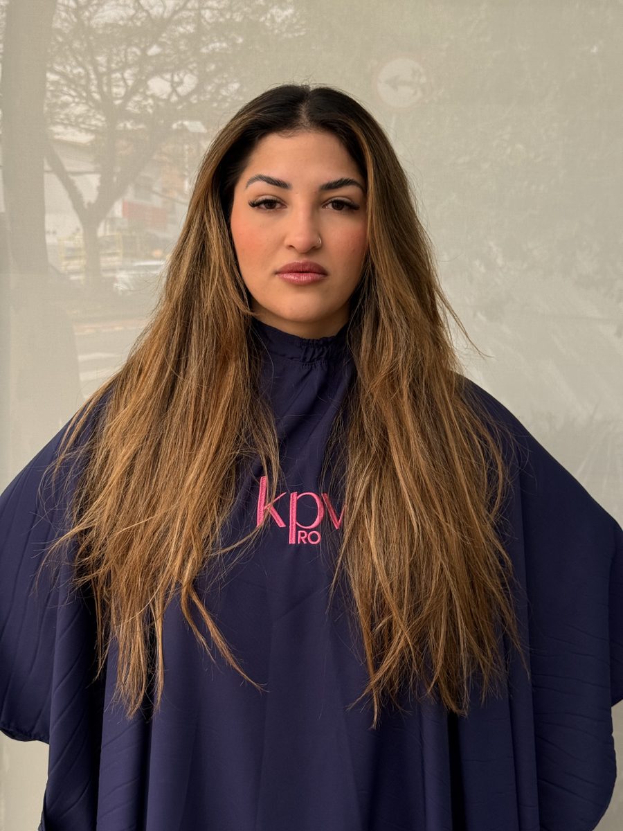 Client before the treatment wearing the KPV Pro cape